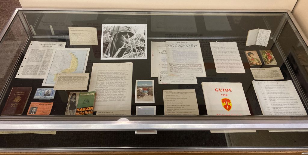 Documents from the Daniel Ellsberg papers in a glass case