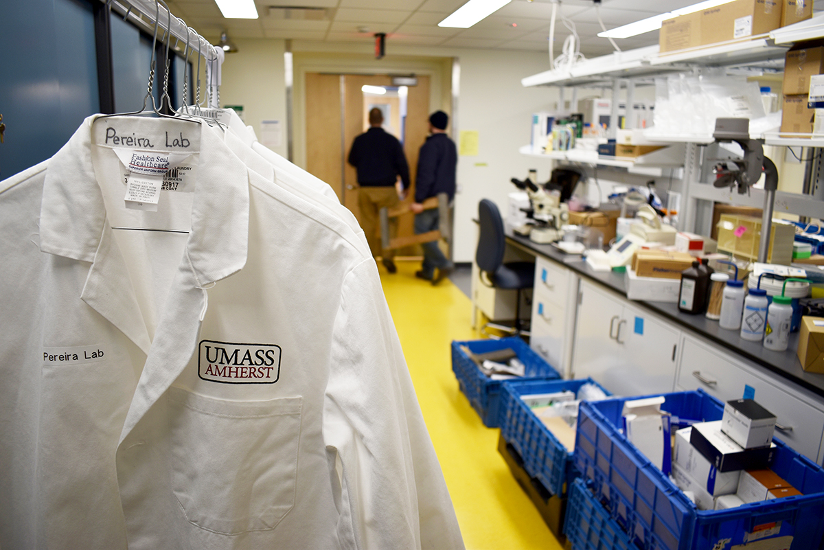 lab coats hang in new space