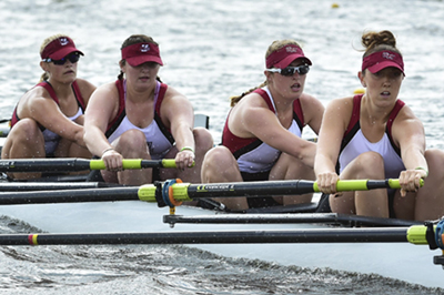 womens rowers compete in river race