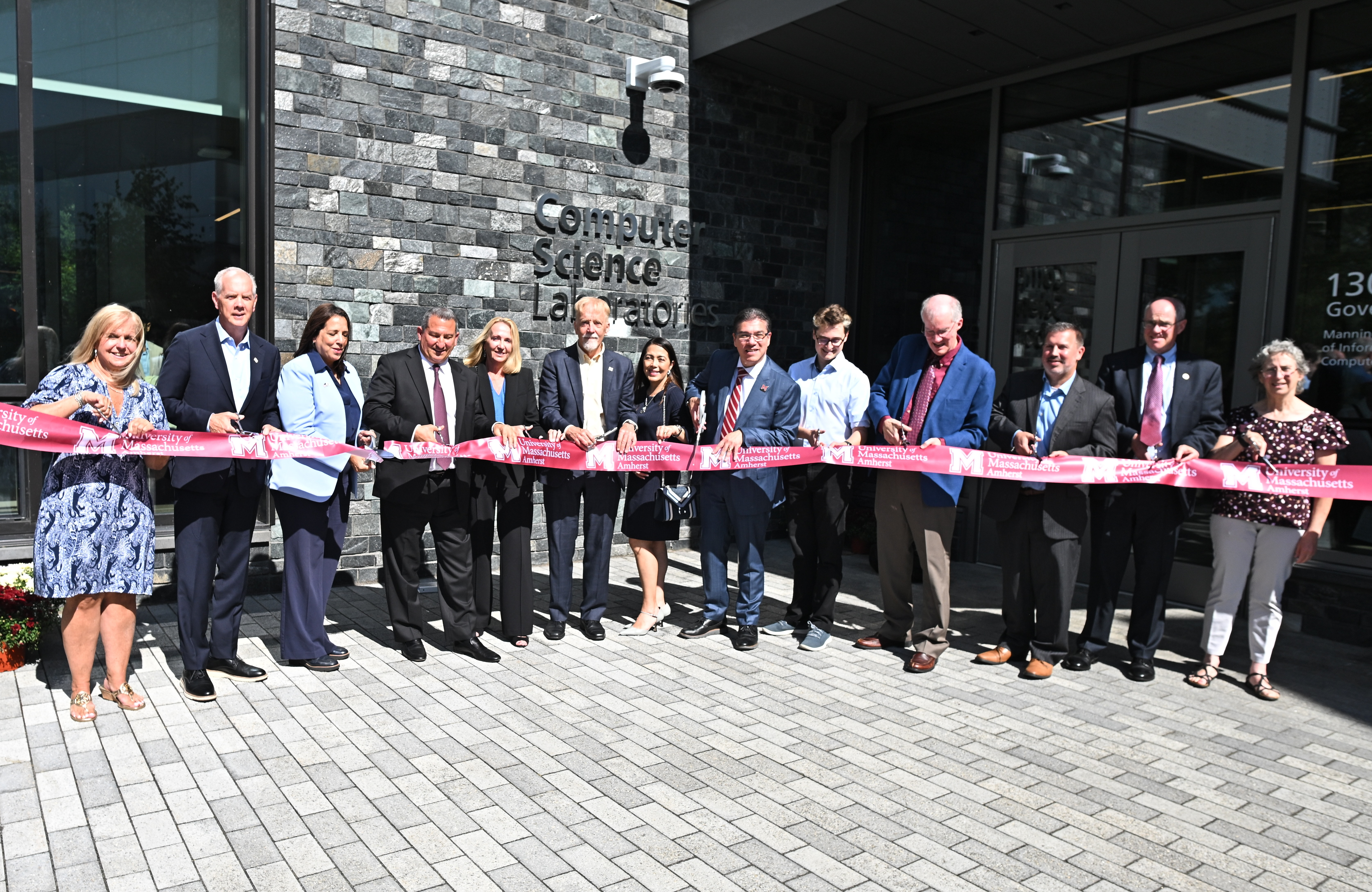Dignitaries prepare to cut the ribbon outside the Computer Science Laboratories Building on Sept. 10, 2026