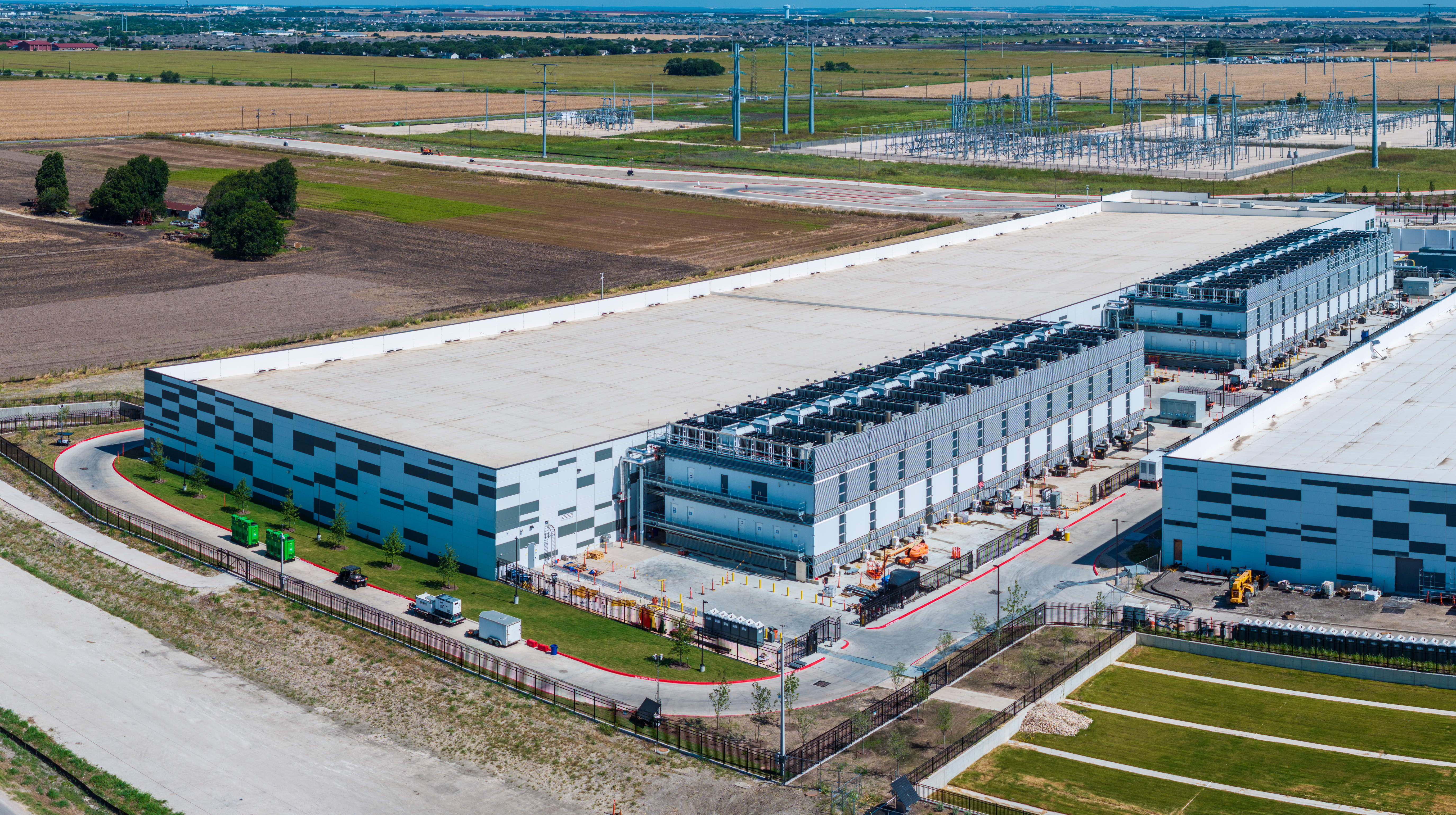 Aerial view of a large data center campus with focus on the processor hosting area and power and cooling infrastructure being built in Hutto, Texas. Credit: Getty Images