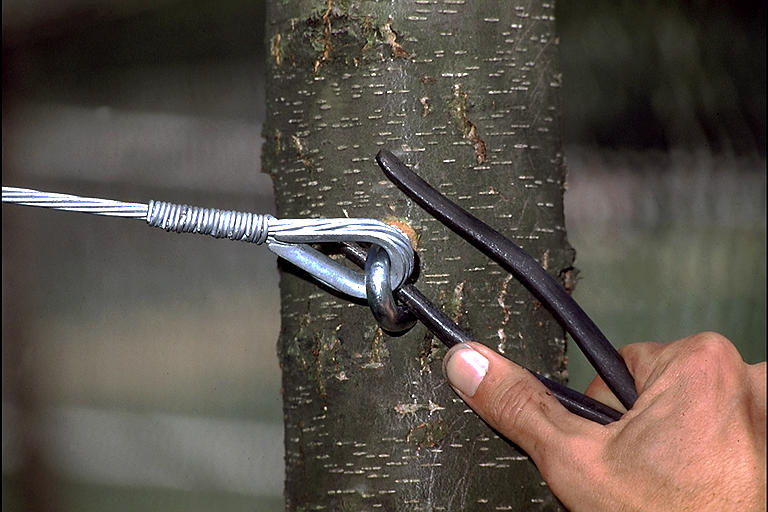 Tightening eye bolt with a cable attached